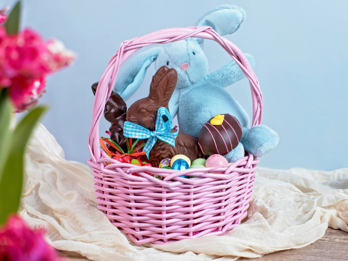 a small Easter basket filled with chocolates and candies.