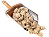 An old-fashioned metal and wooden scoop holds a generous portion of butter crunch squares. 