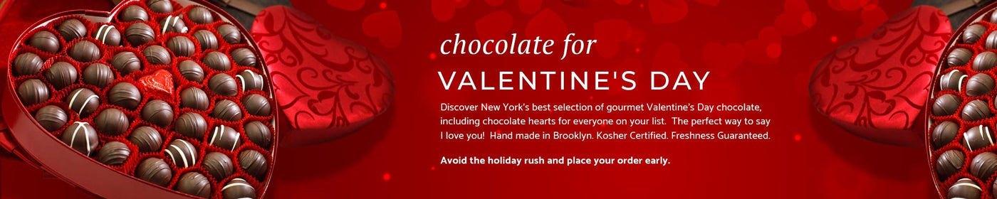 An red valentine heart box filled with truffles on a beautiful red heart background