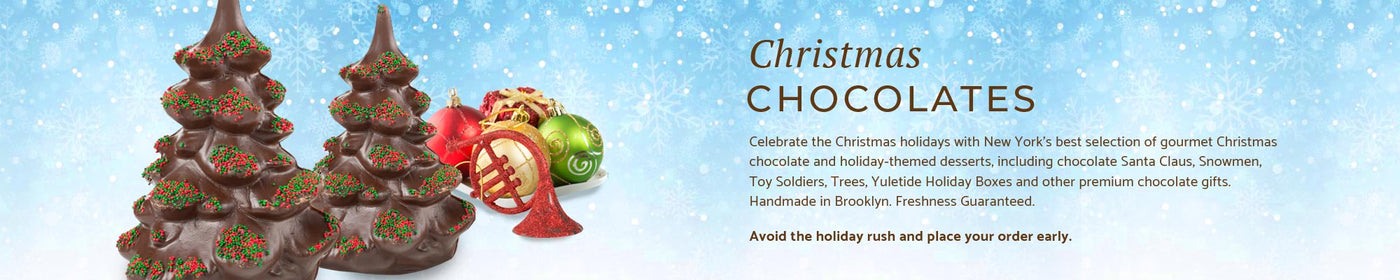 two chocolate trees with some Christmas ornaments sitting behind them on a snowy blue background.