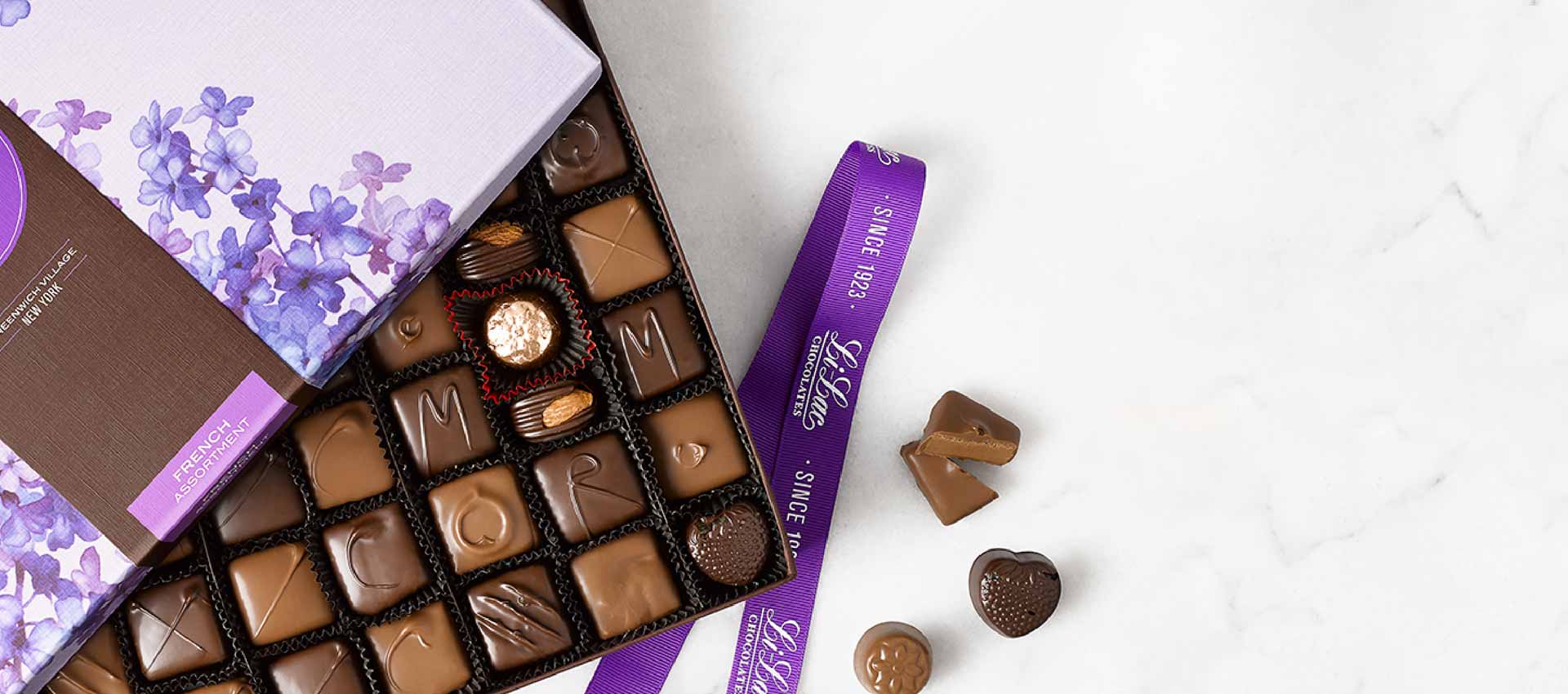 a box of chocolate with the cover partially open