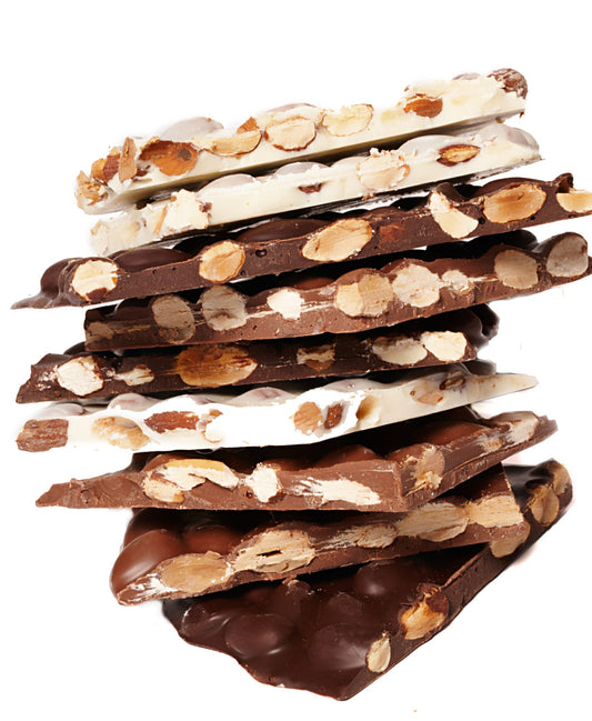 A stack of milk, white and dark almond bark