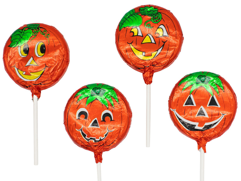 Four chocolate pops with orange foil and pumpkin faces