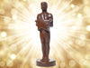 A molded chocolate Achievement Award, it's a man standing tall holding a star.