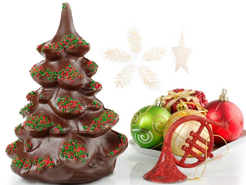 A large chocolate molded evergreen tree with nonpareil candies on the tree boughs in red and green.