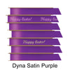 A stack of seven spools of shiny purple satin ribbon with custom messages printed on them in different colors. 