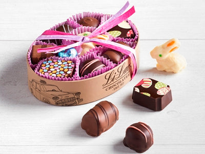 Oval Box filled with 9 chocolates including a white chocolate bunny in the center
