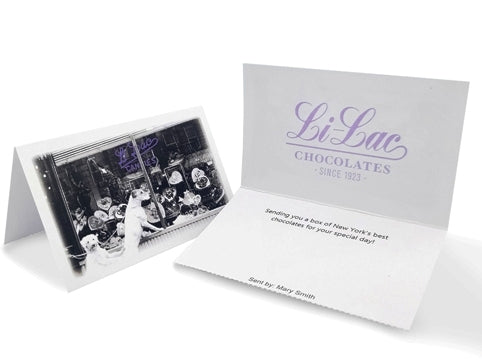 Small bi-fold notecards with a vintage picture of the original location of Li-Lac chocolates on Christopher Street. Inside it says Li-Lac chocolates- since 1923 and a space below for your gift message to be printed.