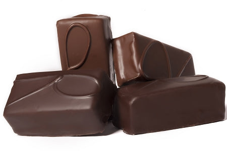 Thick rectangular bars of jellied raspberry, enrobed in dark chocolate are stacked together. The bars have a letter R piped in dark chocolate on the tops. 