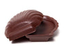 A molded chocolate three-dimensional Sea Shell. The two halves are separate.