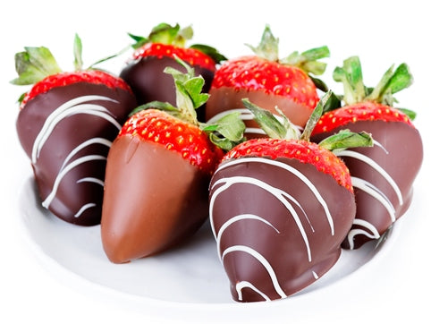 Large, plump strawberries are dipped in milk and dark chocolate. The dark chocolate has white chocolate artfully drizzled on them.
