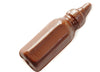 Milk chocolate molded into the shape of a baby bottle. It is three-dimensional, but it does have a flat back.