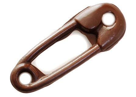 Milk chocolate molded into the shape of a two-dimensional diaper safety pin. 
