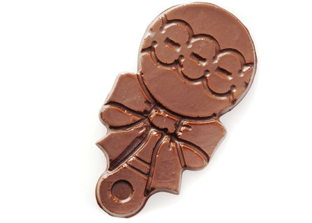Milk chocolate molded into the shape of a two-dimensional rattle with a bow.
