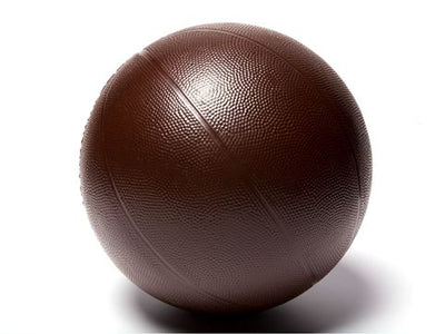 A life-size basketball molded out of dark chocolate. It has the texture and grooves like a real basketball.