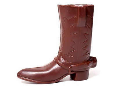 A chocolate molded cowboy boot with spur and leather stitching detail.