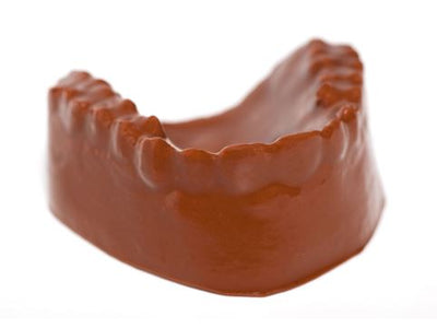 Three-dimensional chocolate molded dentures.