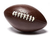 Life size molded chocolate football has pigskin texture and white chocolate stitching details.