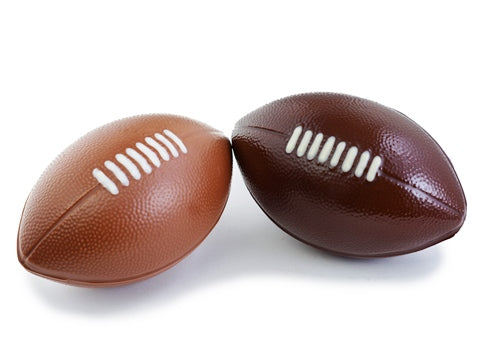 Little molded chocolate Footballs have whote chocolate stitching details.