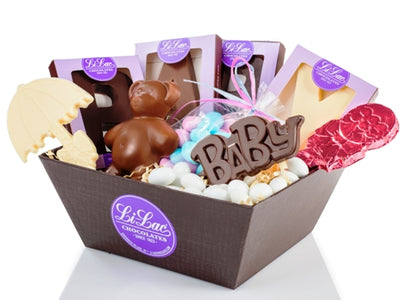 A basket is filled with assorted chocolate goodies.