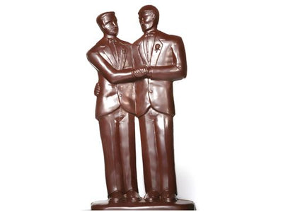 Two molded chocolate Grooms stand side by side in smart suits. 
