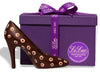 A life size chocolate molded three-dimensional high heel. It is chocolate with polkadots.