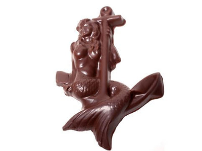 A molded chocolate mermaid sits on a ships anchor.