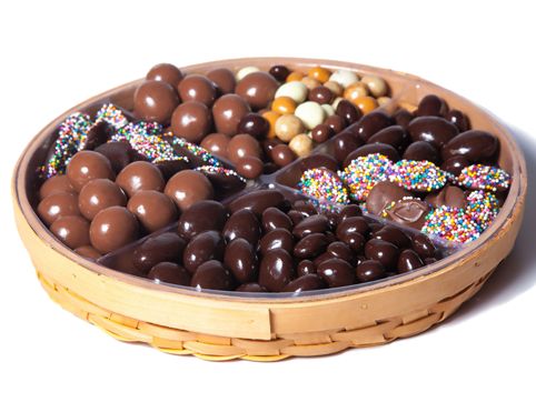 Malt balls, chocolate covered almonds, espresso mix and nonpareils are artfully placed on a platter.