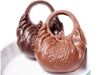 Little chocolate molded handbags with a round handle.