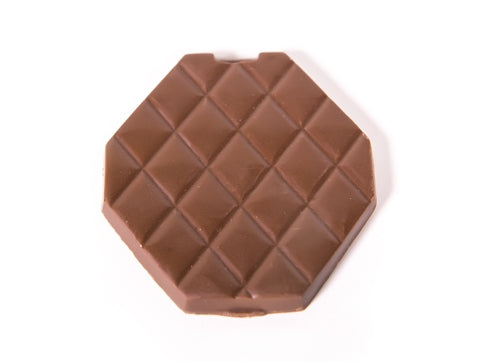 A three-dimensional chocolate molded hexagon shaped Makeup Compact.