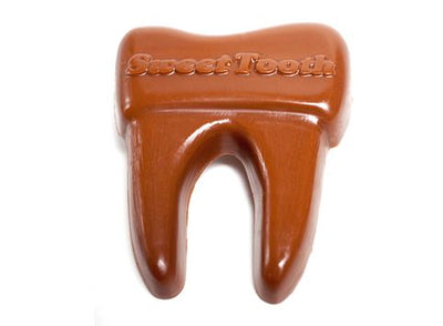 Chocolate molded molar tooth with roots. It has 'Sweet Tooth' molded onto the top.