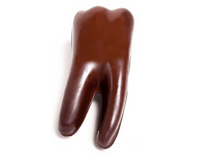 Chocolate molded molar with roots.