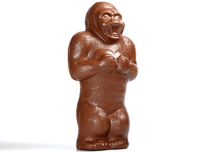 Giant molded chocolate King Kong style gorilla. He beats his chest with a wide mouth growl.