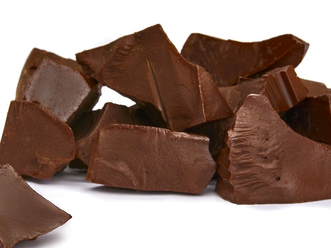 Dark chocolate is broken up into rustic chunks.