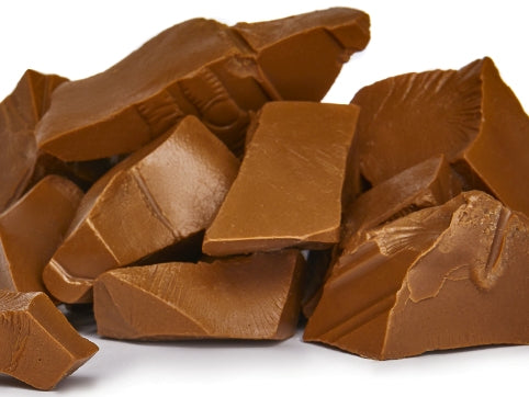 Milk chocolate is broken up into rustic chunks.