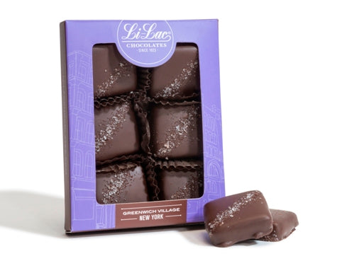 A purple card stock window box holds six Salted Caramel squares.