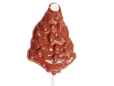 A molded chocolate evergreen tree pop on a stick.