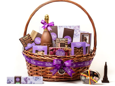 A large wicker basket filled to bursting with chocolate treats.