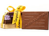 The congratulations bar is part of a bundle of gifts stacked together and tied with a yellow congratulations ribbon.