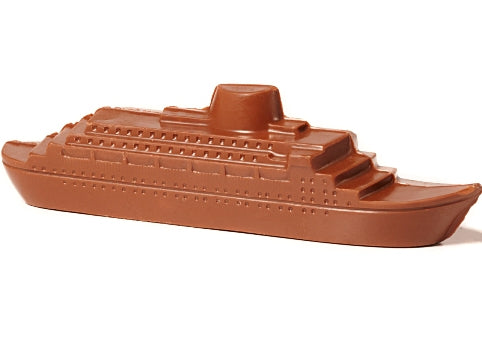 A molded chocolate cruise ship has deck levels and little window details.