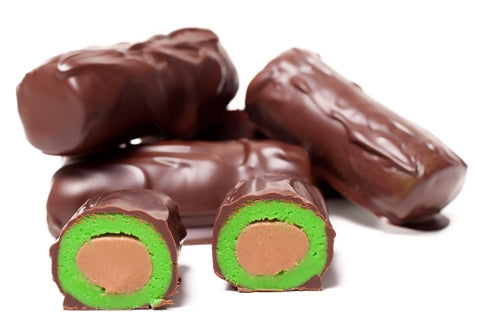 Hazelnut center is wrapped in green marzipan paste and enrobed in dark chocolate iwth bark detail.