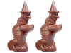 Molded chocolate witches fly away on broomsticks wearing pointy witch hats.
