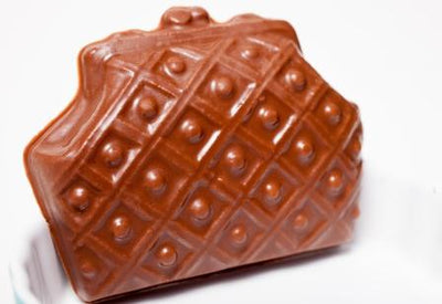 A molded chocolate textured clasp purse.
