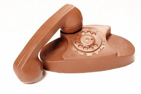 Vintage princess phone has removable handset and round dial.