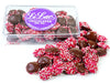 Nonpareils in a clear acrylic box, they are decorated with red, pink and white nonpareils candies.